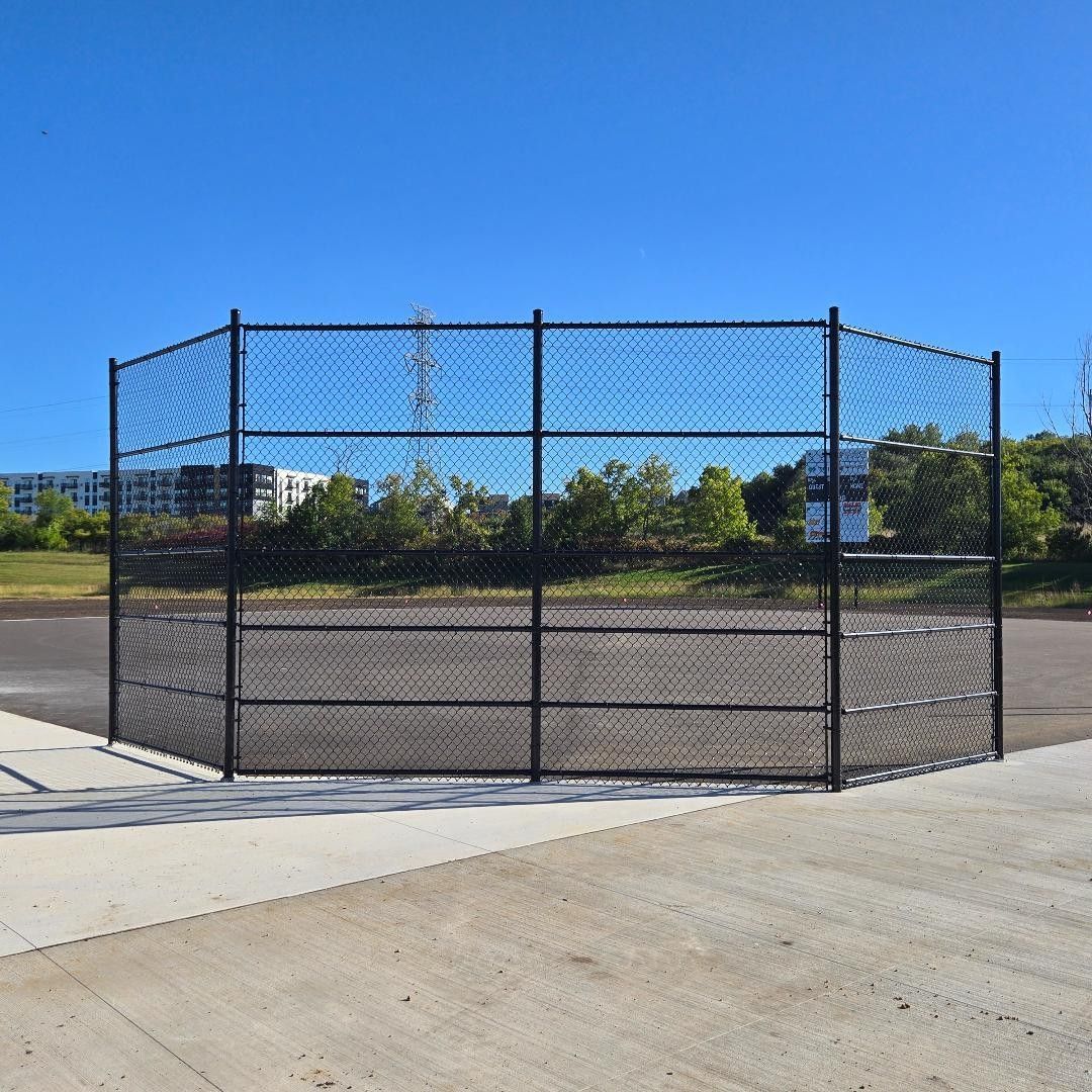 Fencing and concrete work installed around the field