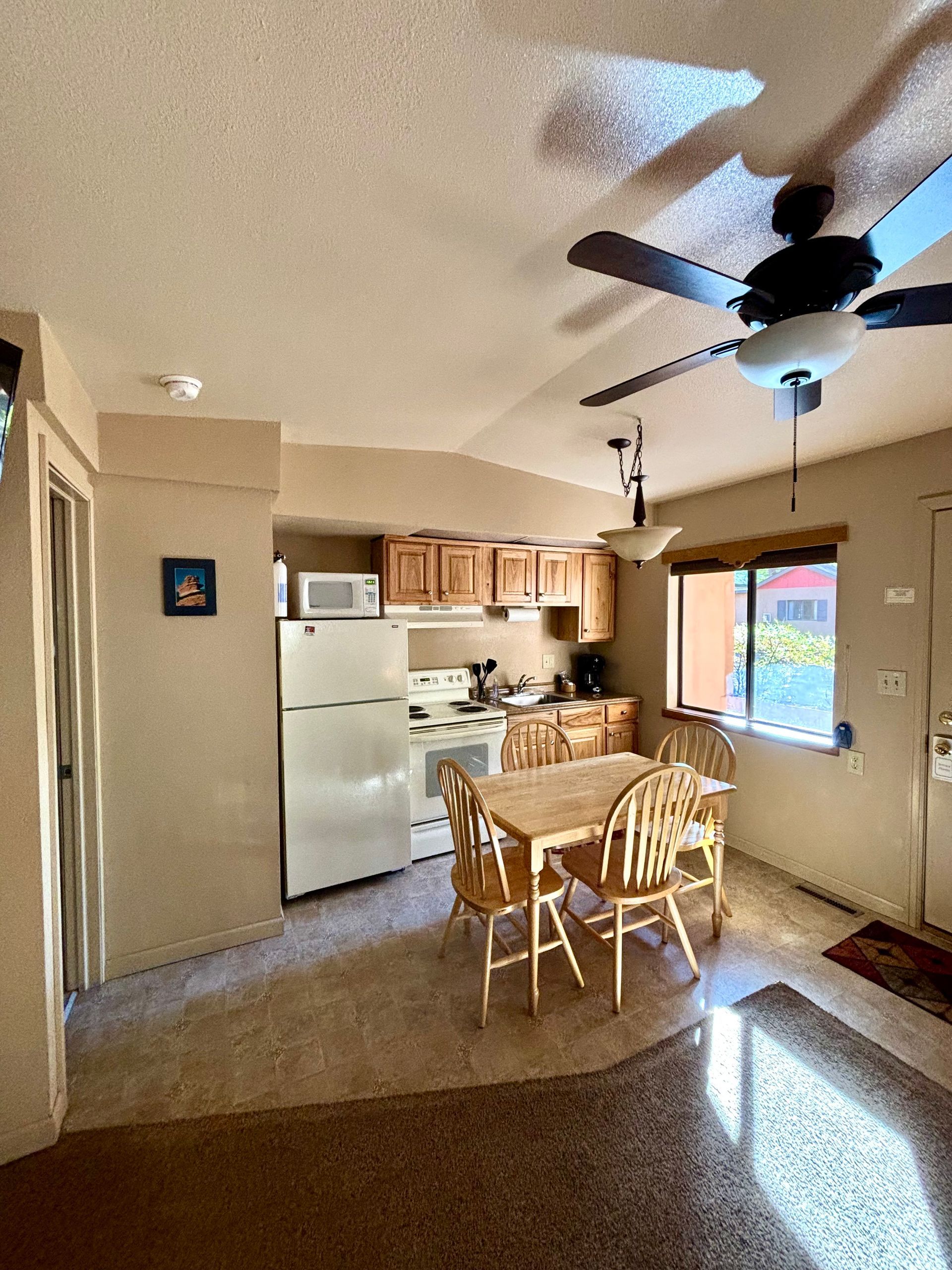 Fully stocked kitchen with dining table and chairs