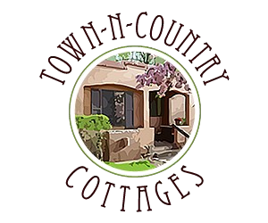 A logo for town-n-country cottages with a picture of a house