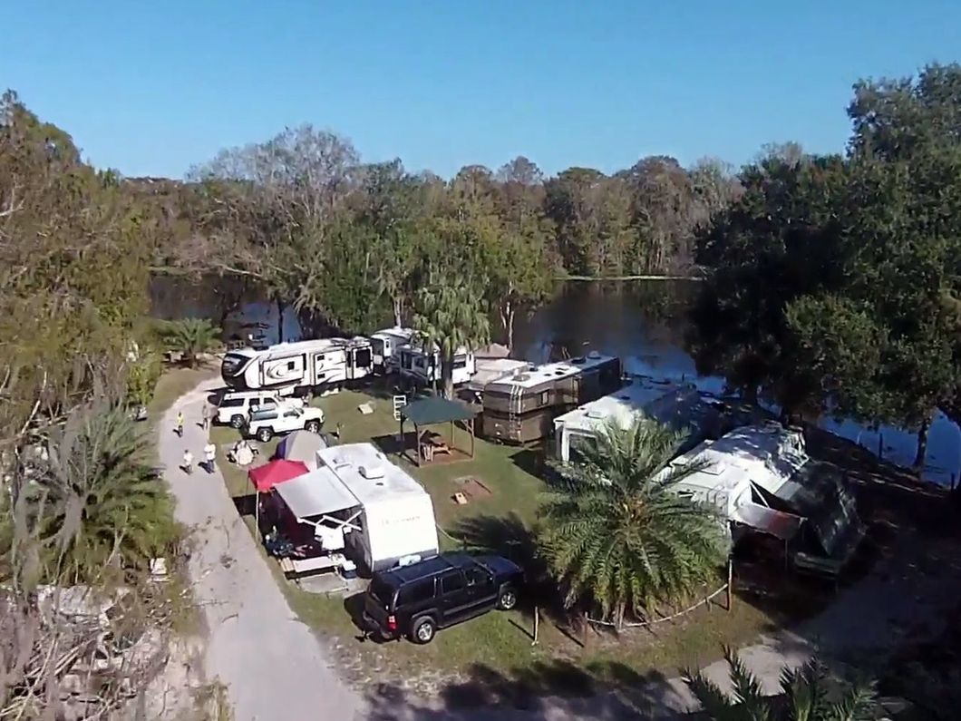 an aerial view of a rv park near a lake