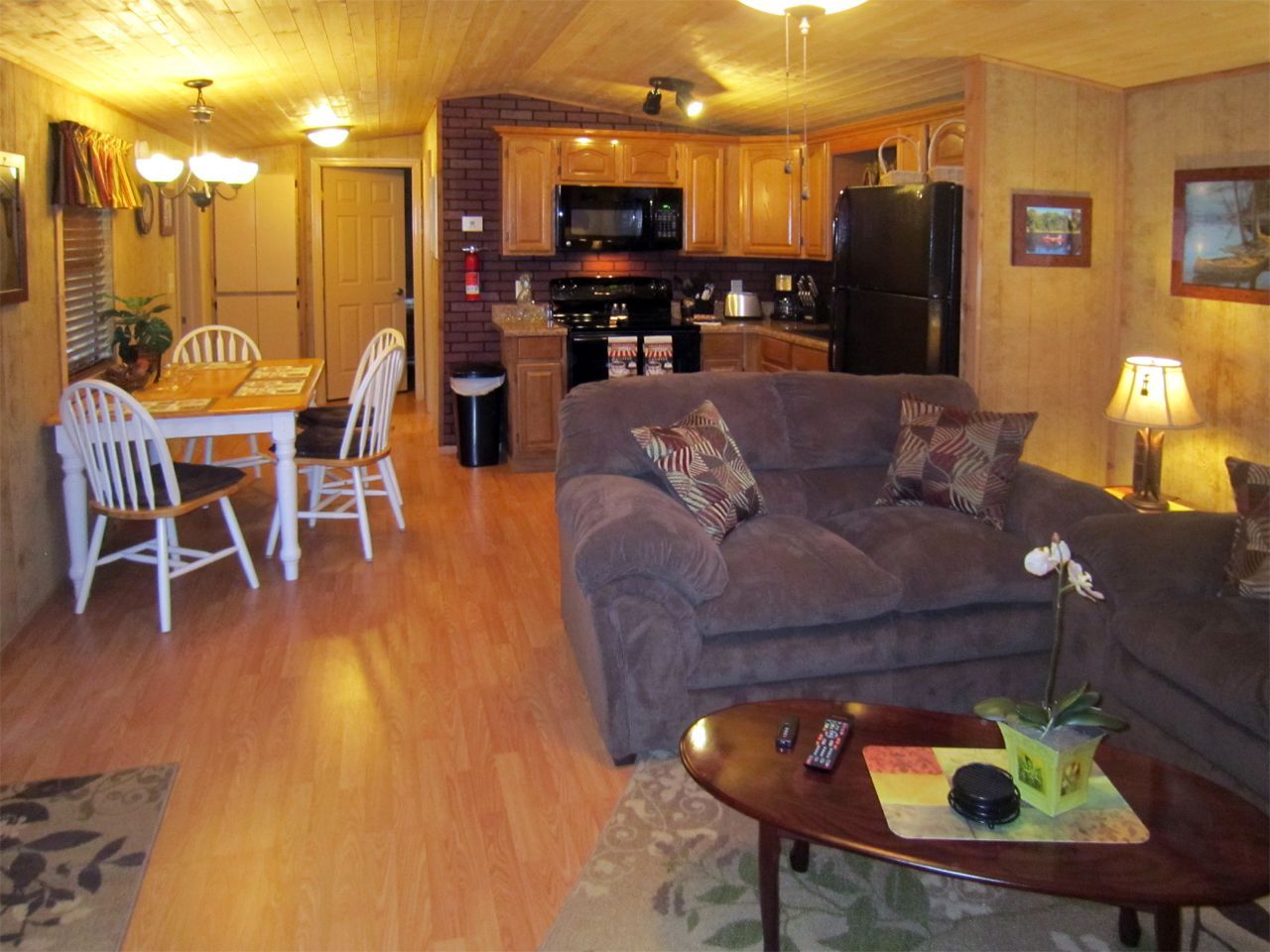 a living room with a couch a table and chairs