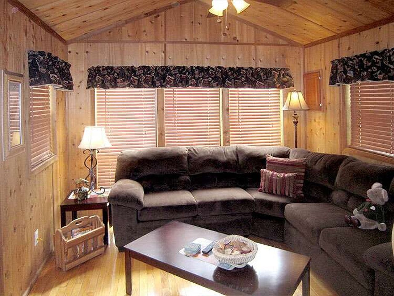 a living room with a sectional couch and a coffee table