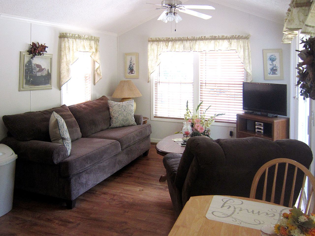 a living room with a couch a table and a television
