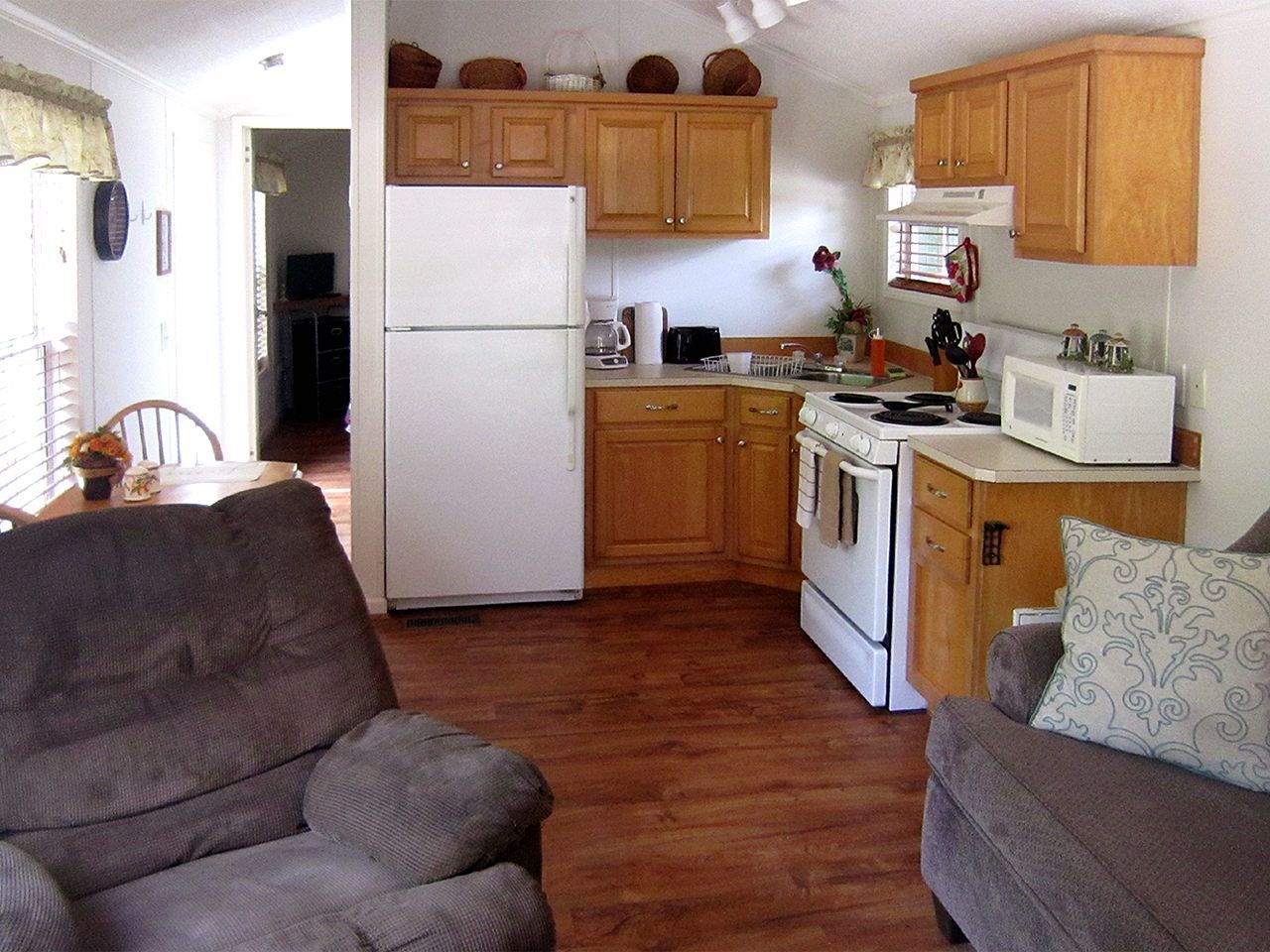 a kitchen with wooden cabinets and a white refrigerator