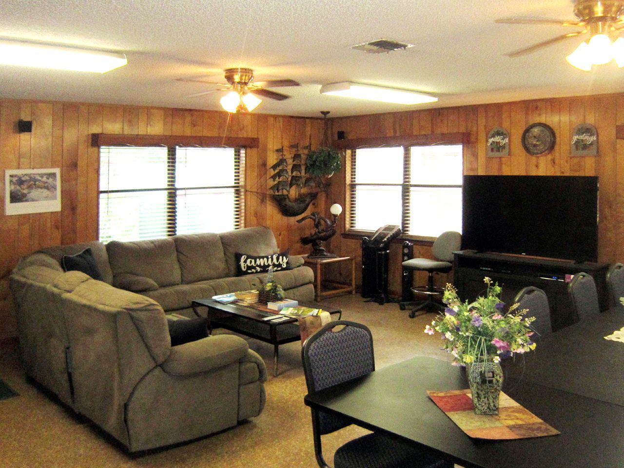 a living room with a couch that says coca cola on it