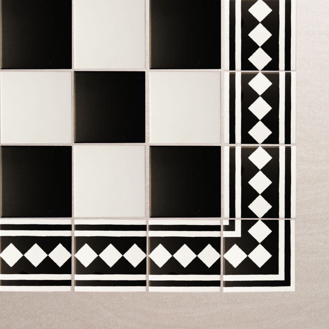 A black and white checkered tile with a diamond border