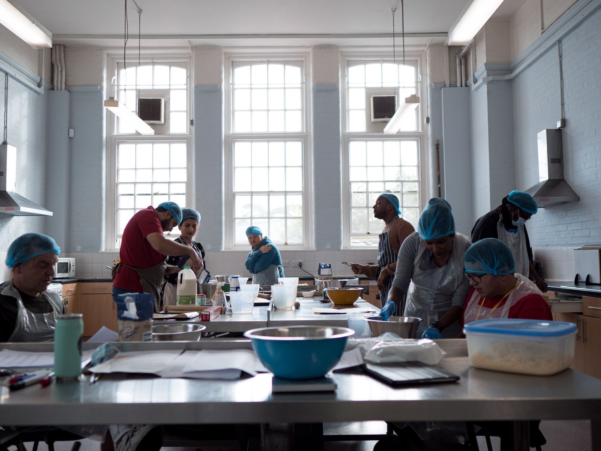 A group of people are working in a kitchen.