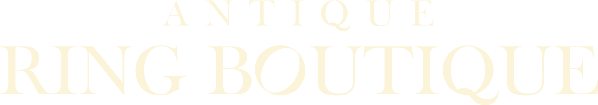 A white background with the words `` antique ring boutique '' written on it.