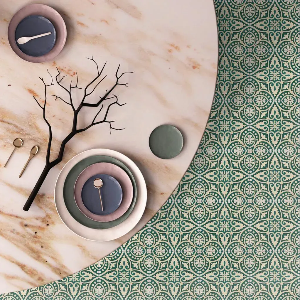 A table with plates spoons and a tree on it