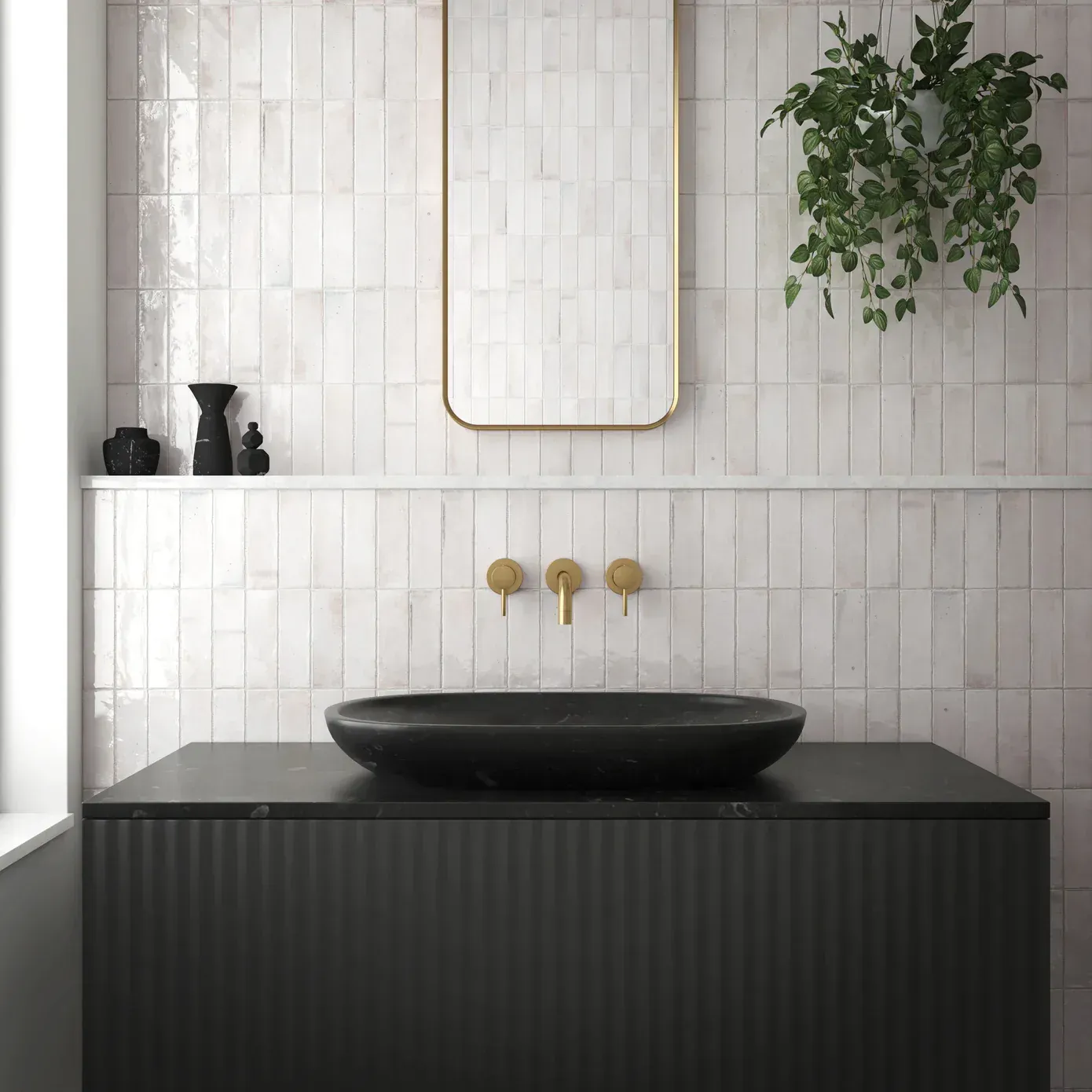 A bathroom with a black sink and a mirror on the wall.