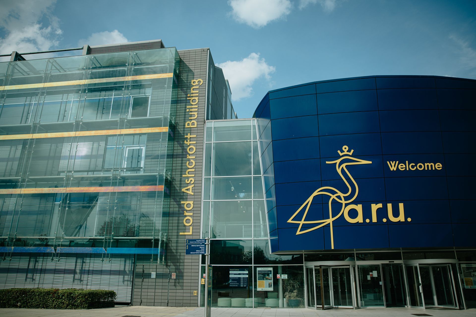 A large blue building with a welcome sign on the front of it.