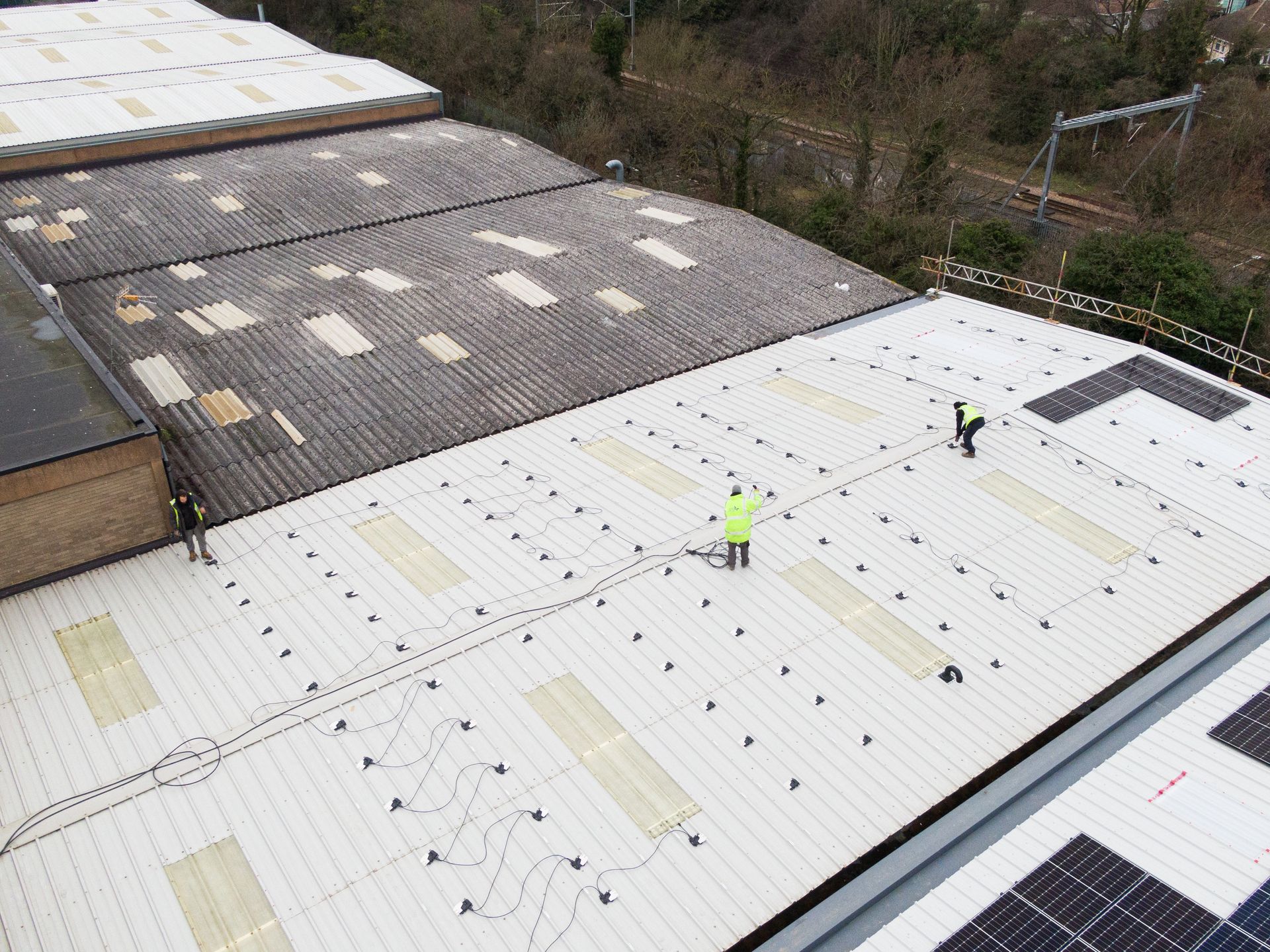 An aerial view of a roof with solar panels on it