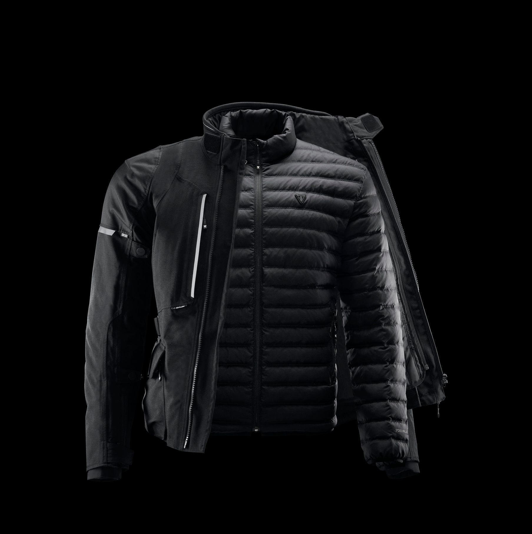 A black jacket with a backpack attached to it on a black background.