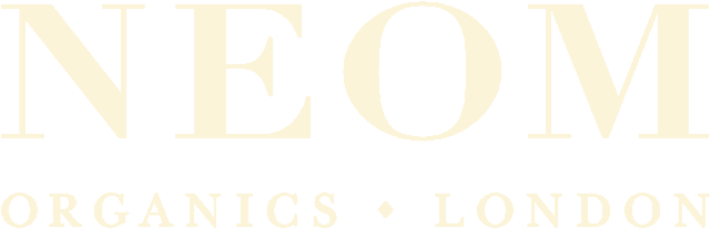 The logo for neom organics london is yellow on a white background.