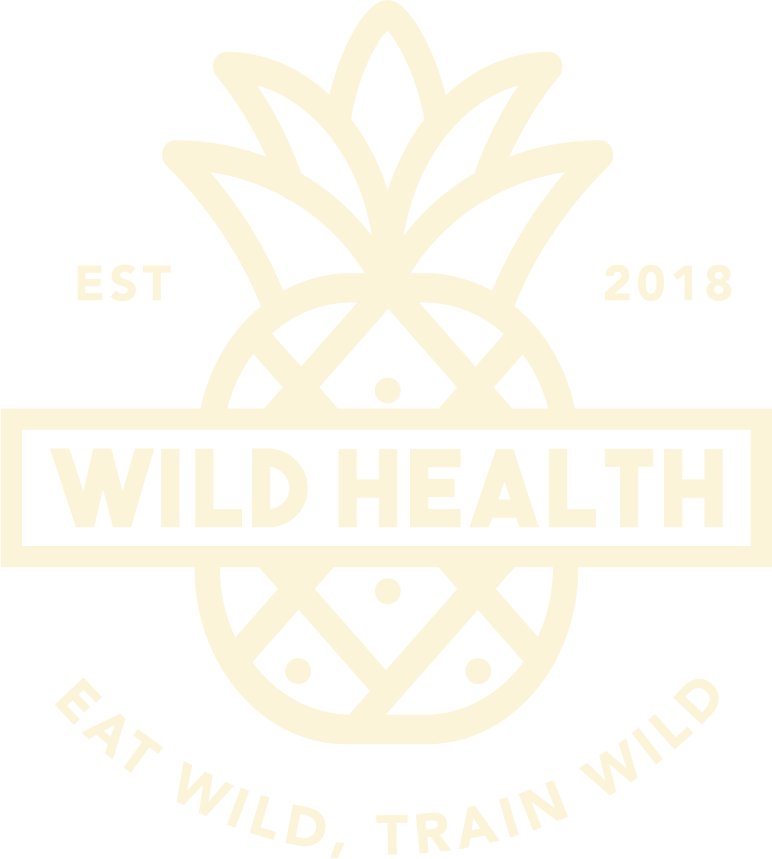 The logo for wild health is a pineapple with the words `` eat wild , train wild ''.