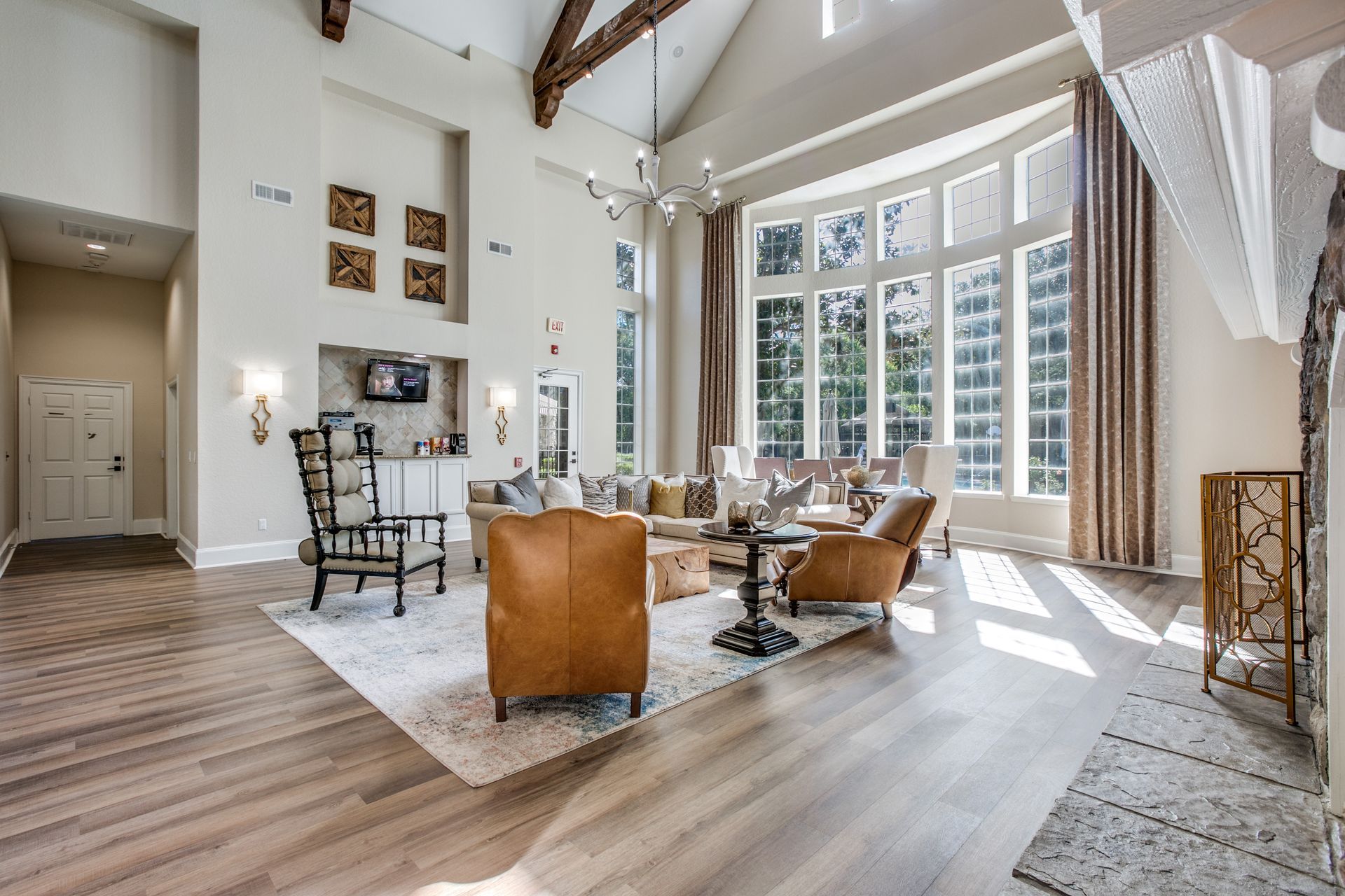 Apartment clubhouse filled with furniture and lots of windows at Marquis Champions Forest offers pet-friendly apartments in Houston, TX.
