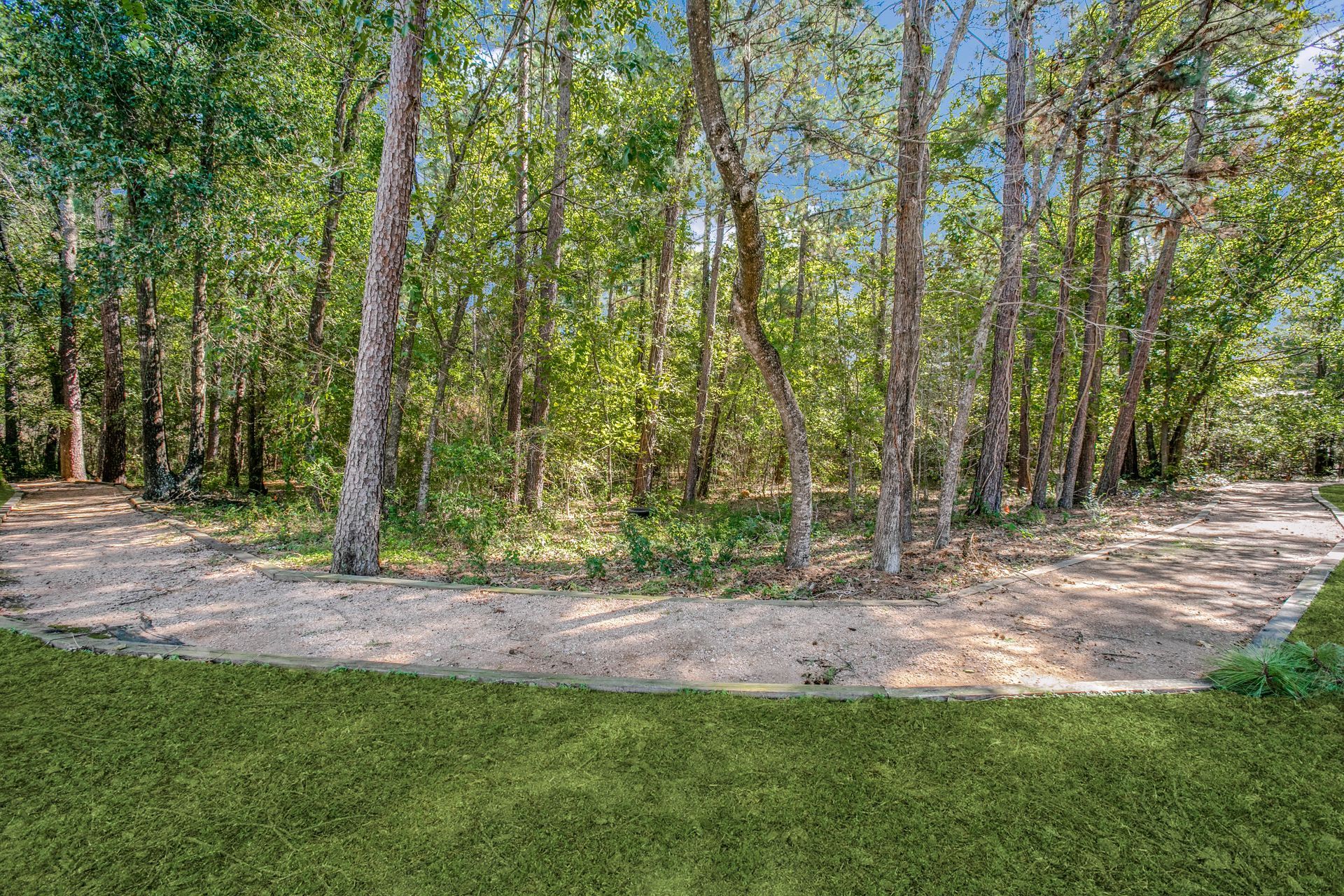 There is a dirt road going through the woods at Marquis Champions Forest offers luxury apartments in Houston, TX.