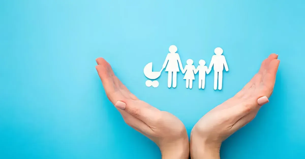 Hands cupping white family icons on a blue background, symbolizing protection and care