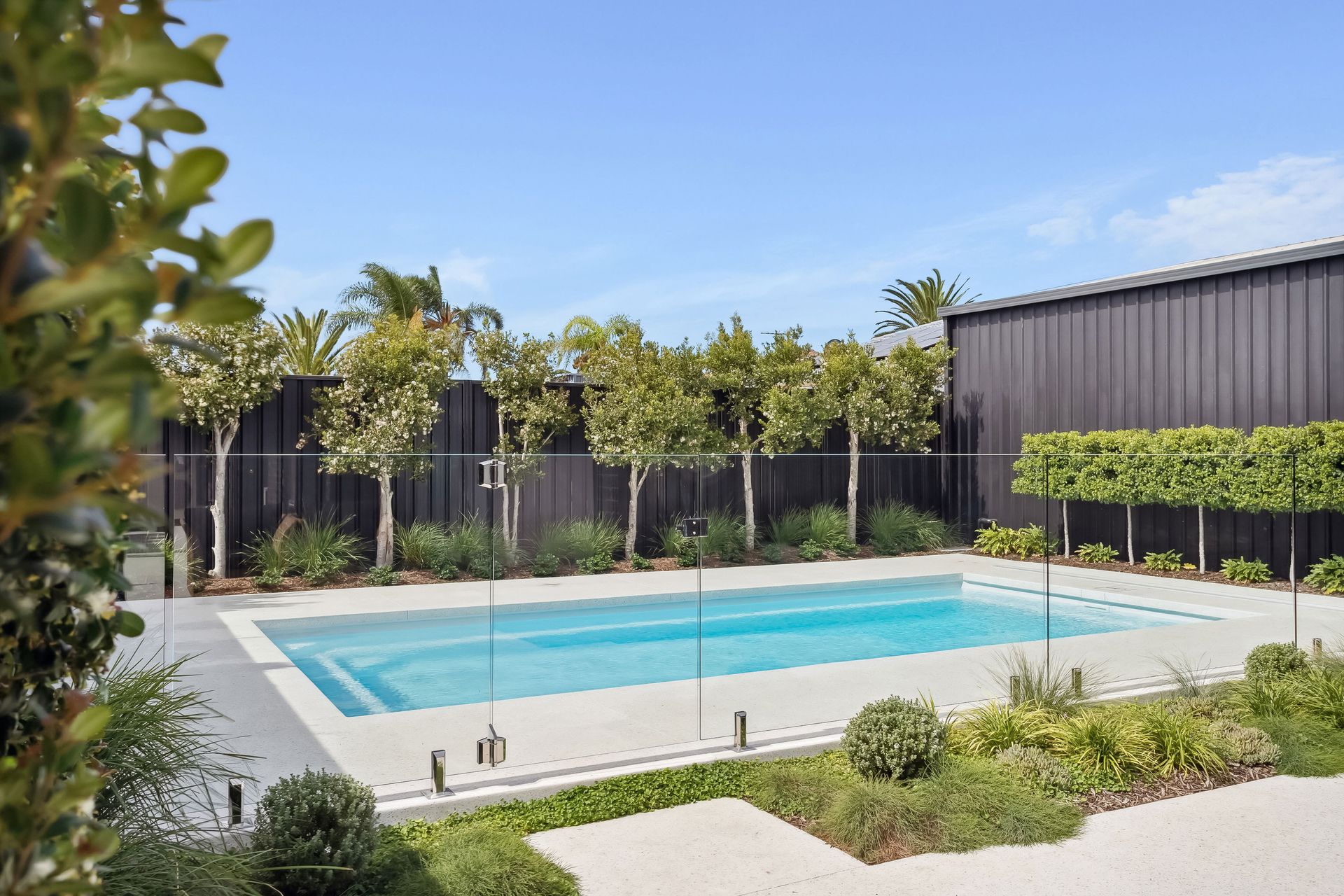 An Aerial View of a Swimming Pool on a Wooden Deck — Gibson Family Pools Pty Ltd In Port Macquarie, NSW