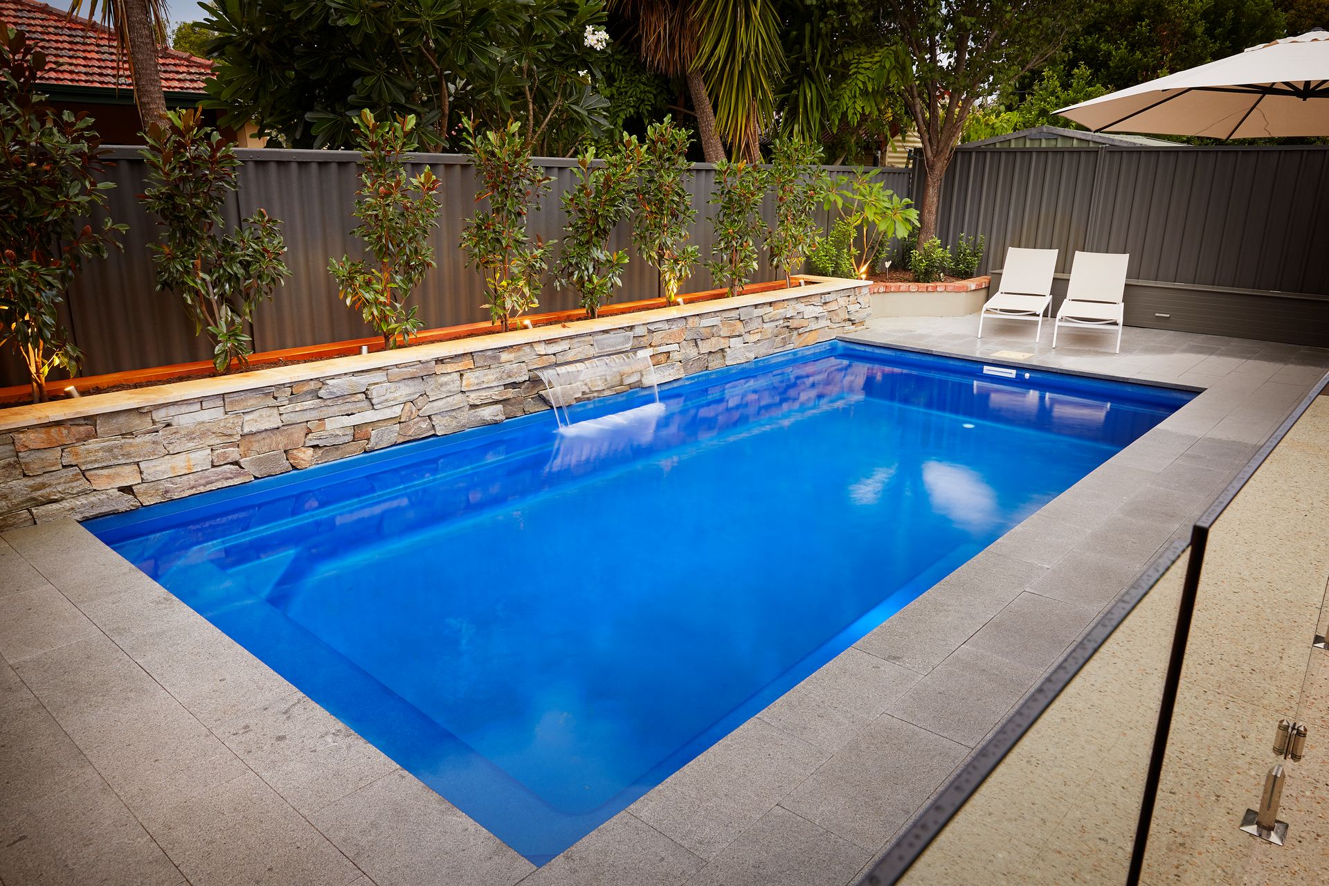 An Empty Swimming Pool With Stairs Leading to It — Gibson Family Pools Pty Ltd In Bulahdelah, NSW