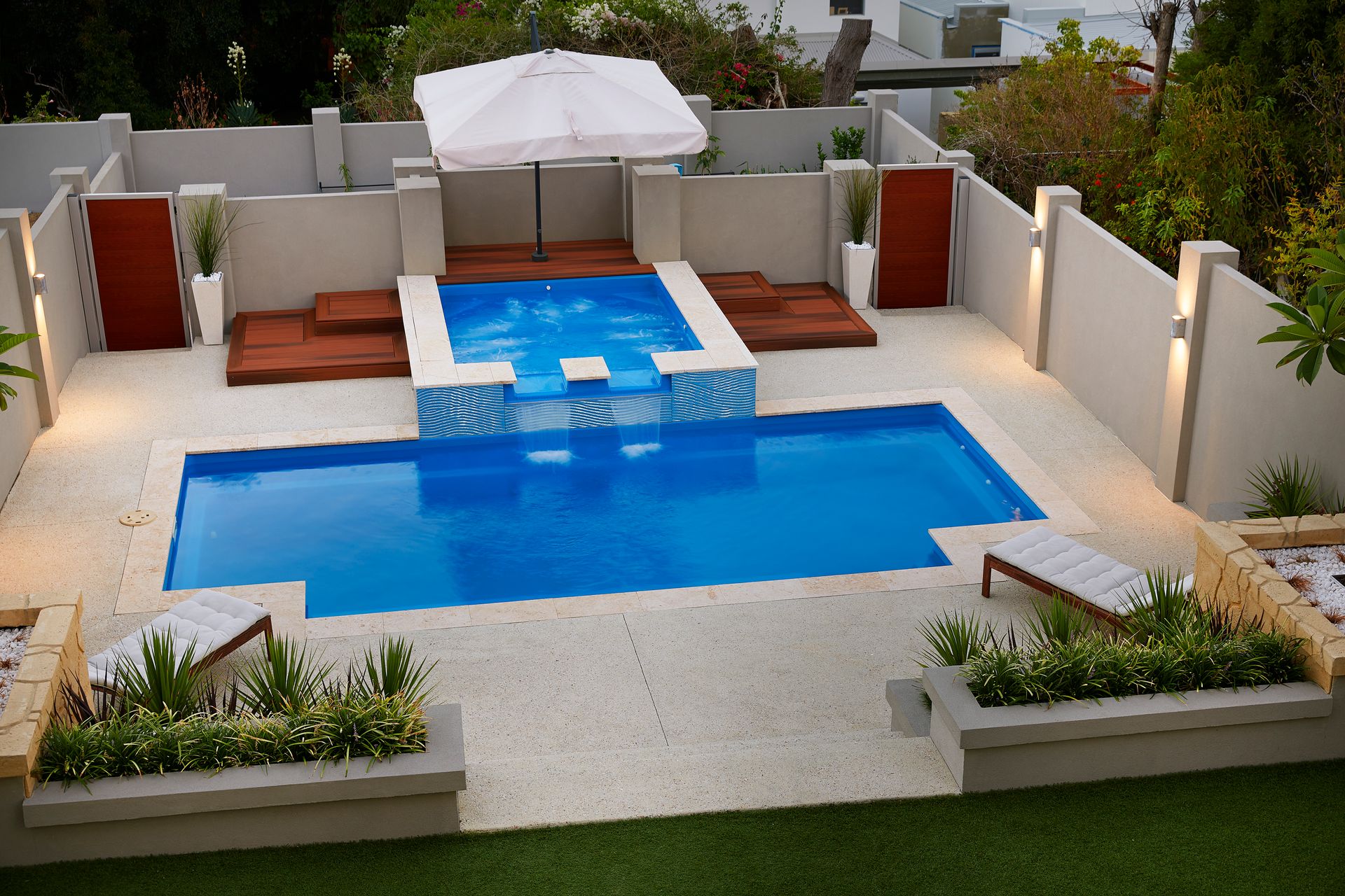 A Large Blue Swimming Pool With a White Border — Gibson Family Pools Pty Ltd In Nambucca Heads, NSW