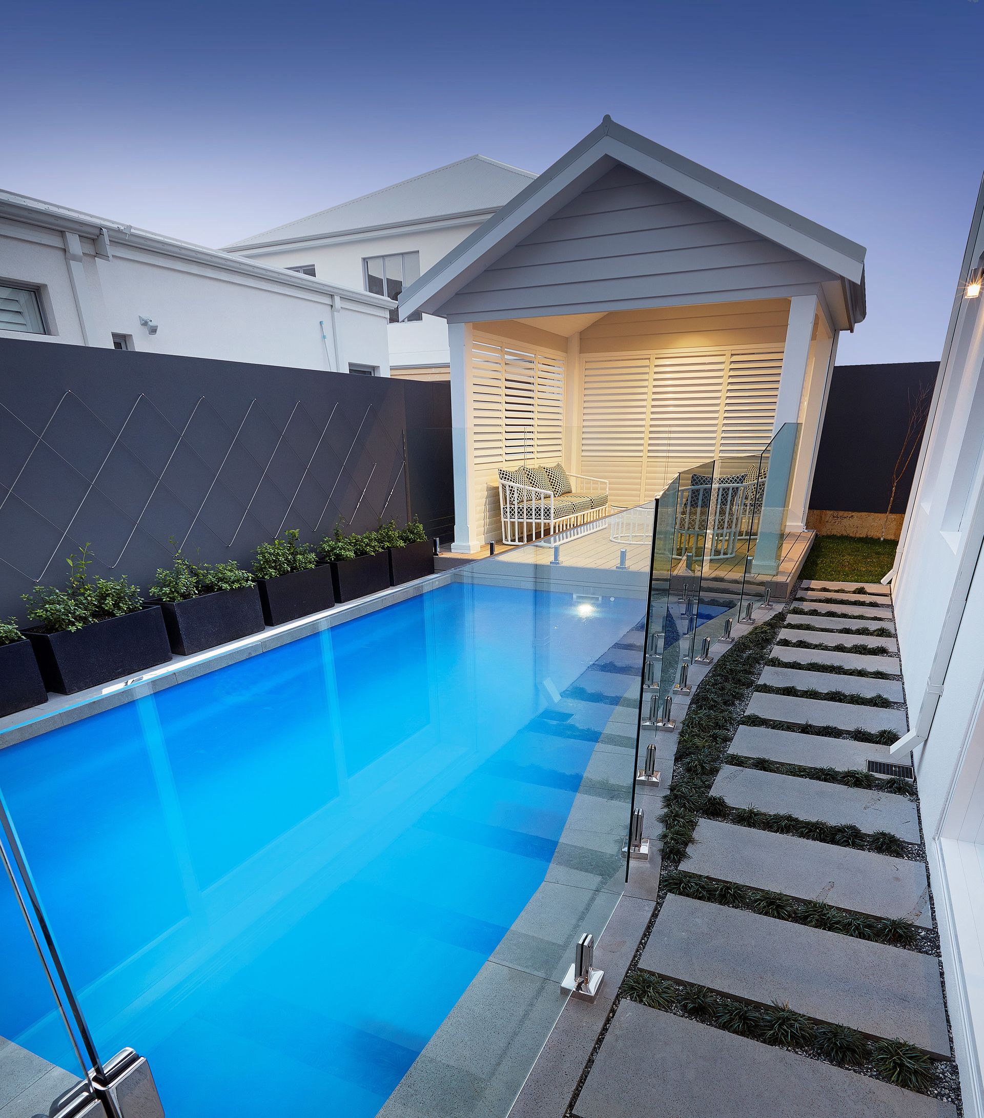 There is a Waterfall in the Middle of a Swimming Pool — Gibson Family Pools Pty Ltd In Kempsey, NSW