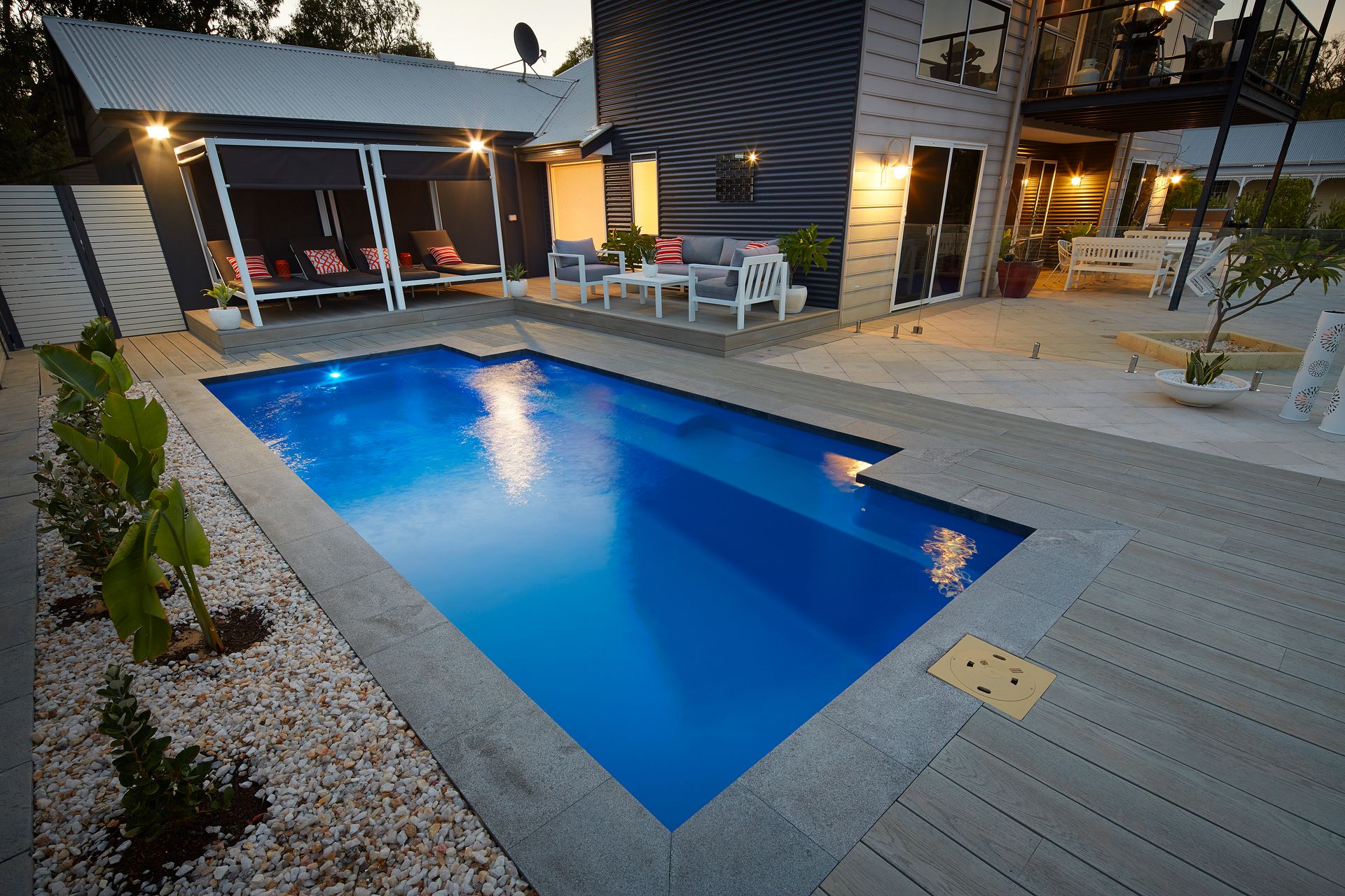 A Blue Swimming Pool is Being Built in a Backyard — Gibson Family Pools Pty Ltd In South West Rocks, NSW