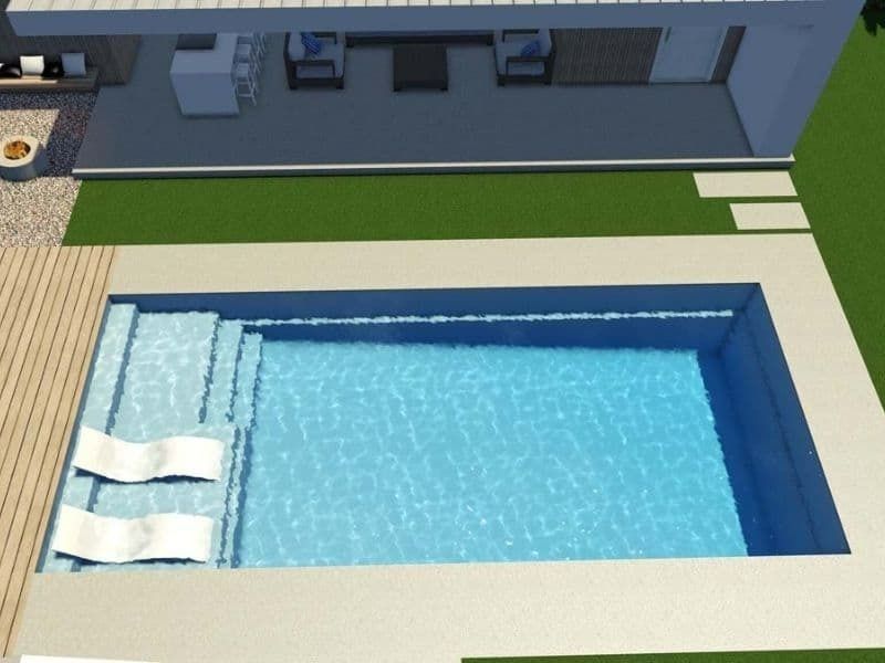 An Aerial View Of A Swimming Pool In Front Of A House — Gibson Family Pools Pty Ltd In Port Macquarie, NSW