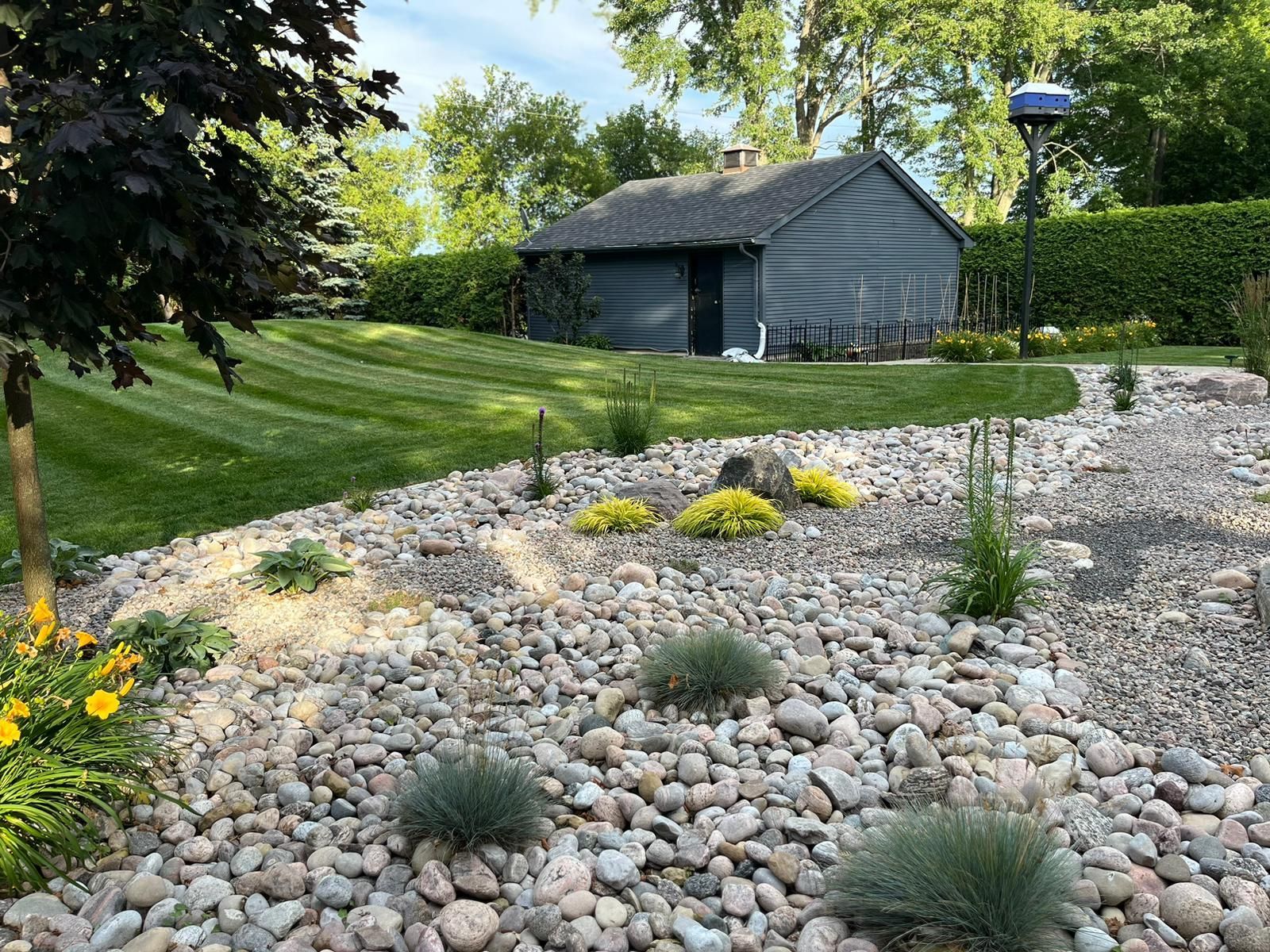 stormwater management, rain garden design, waterwise landscaping, dry creek bed