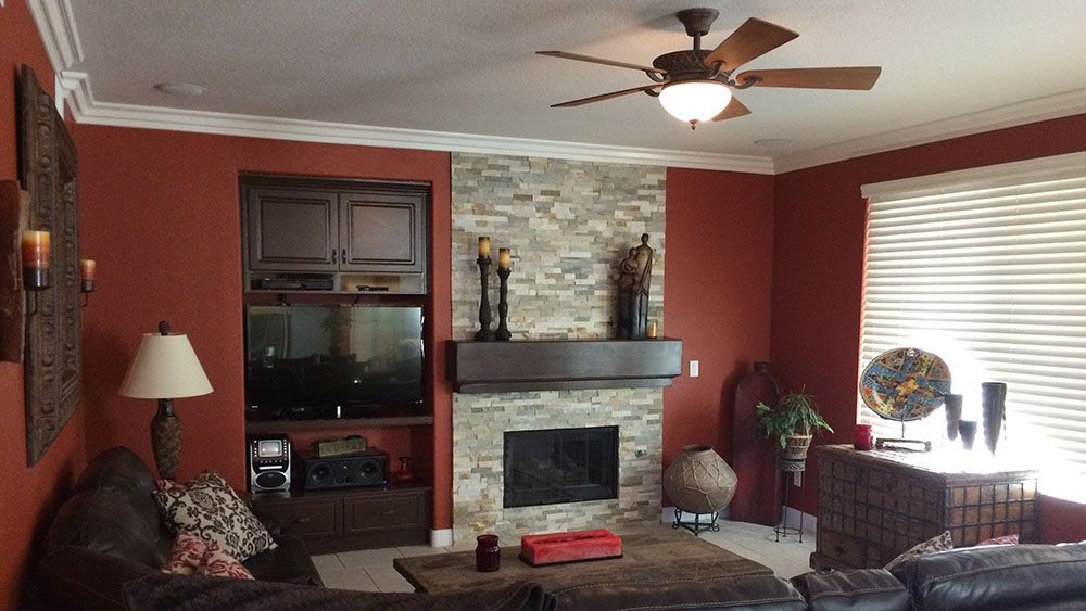 Family room with a wall full of windows