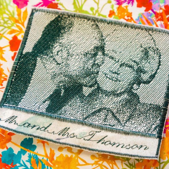 Two stitched portraits on a floral fabric background, with cursive text along the bottom edge.