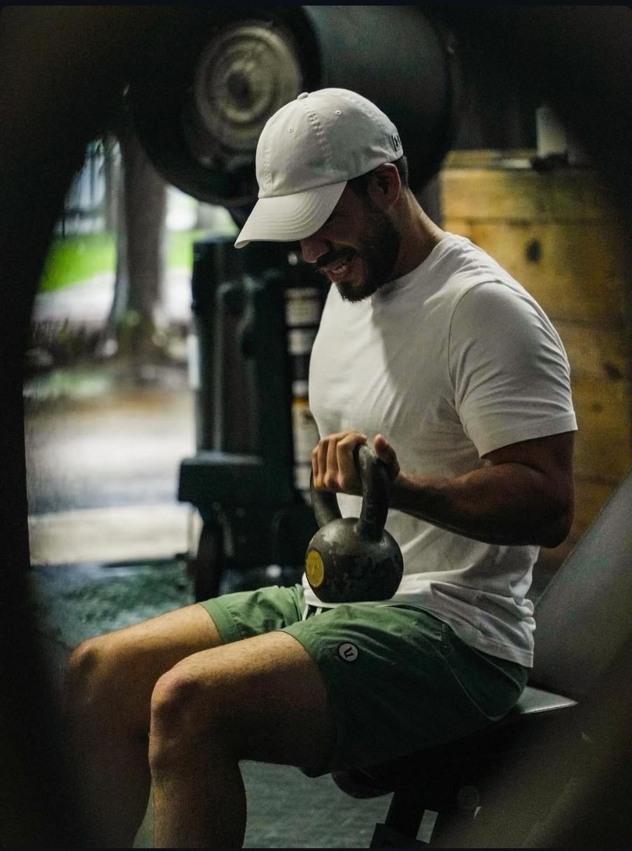 A man is doing bicep curls