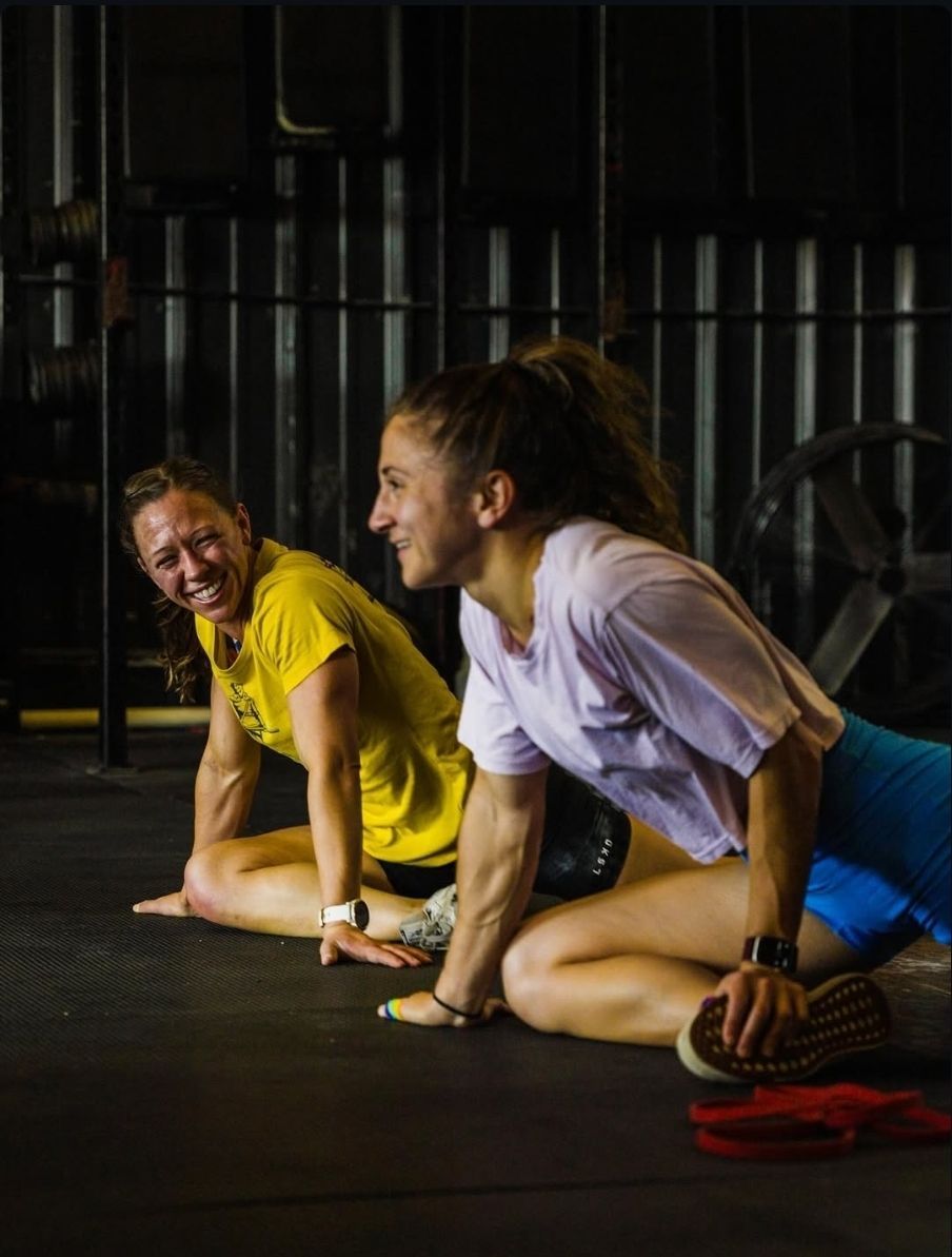 Two attractive women stretching