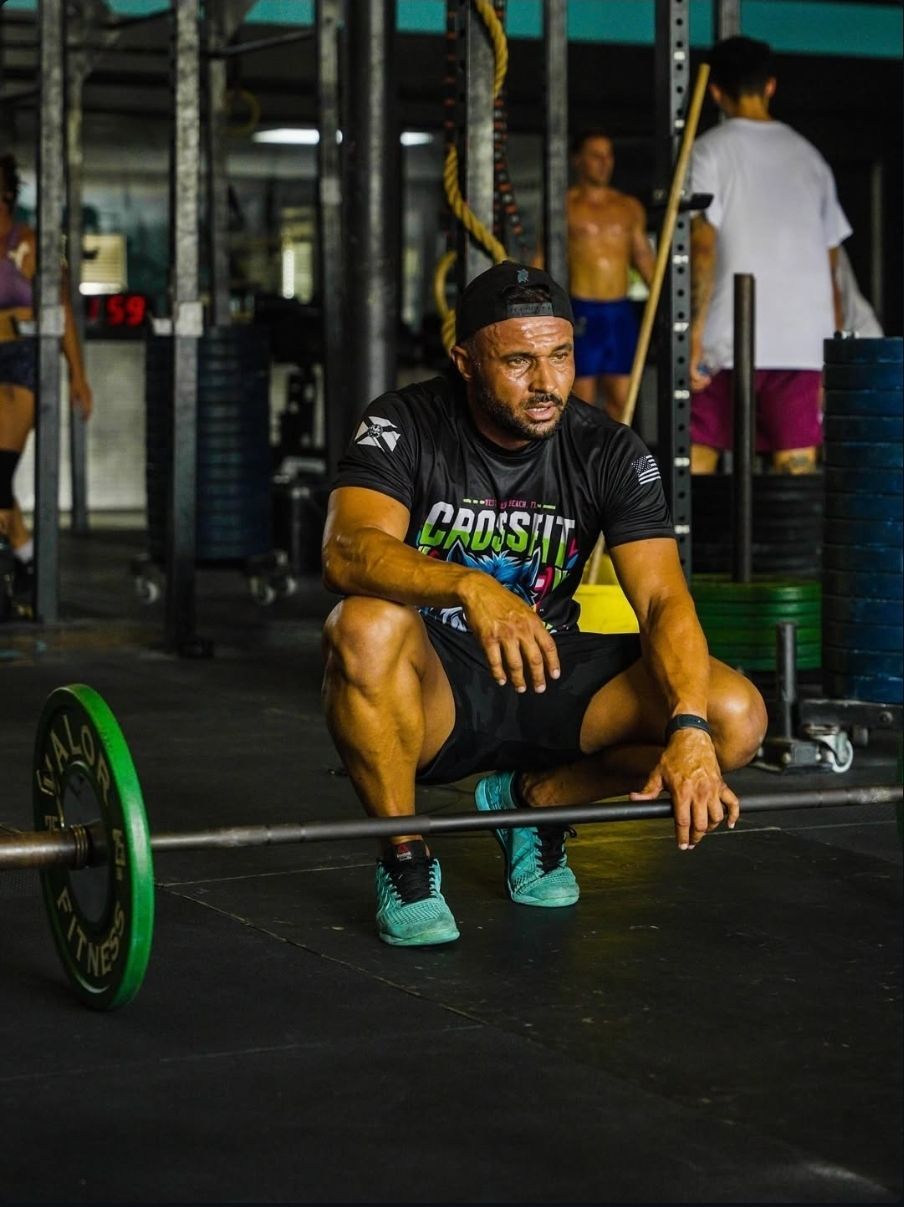 A high performing athlete with a barbell