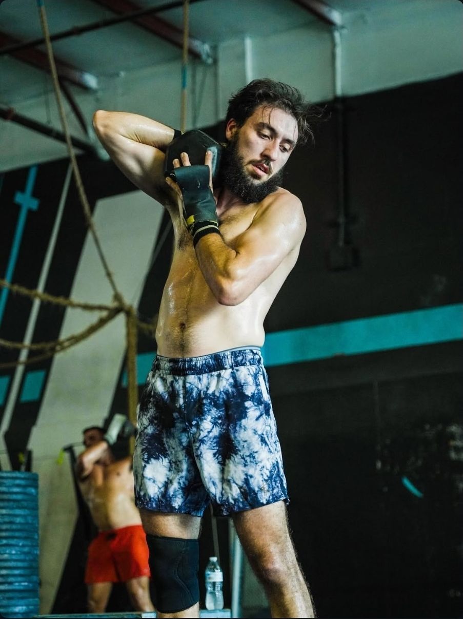 A CrossFit Athlete using a dumbbell
