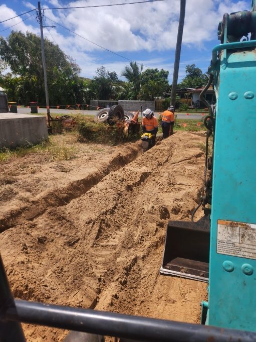 A Group Of Construction Workers Are Working On A Dirt Road — Rockyview Excavations In Rockyview, QLD