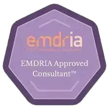Purple octagonal EMDRIA Approved Consultant badge with orange and white text