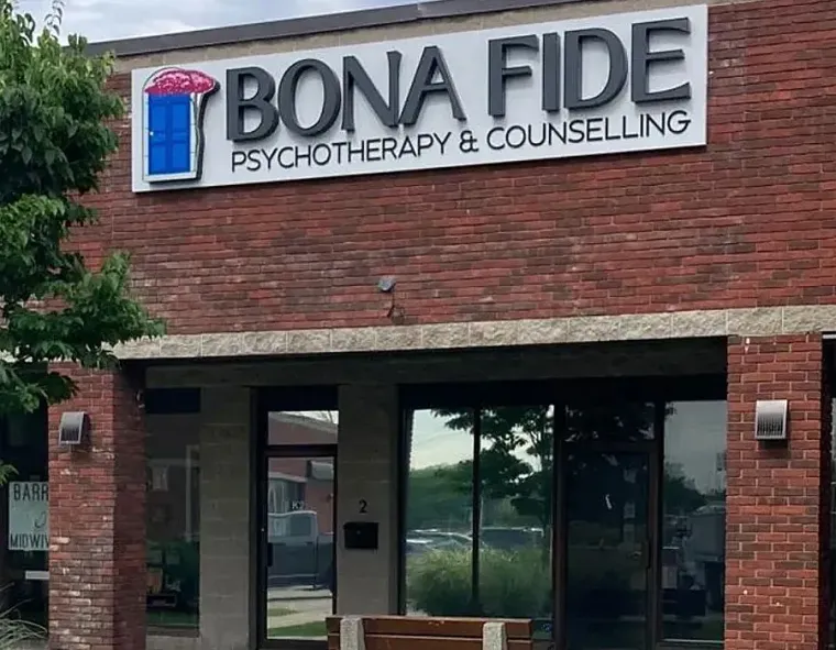 Bona Fide Psychotherapy & Counselling storefront sign on a brick building with glass entrance