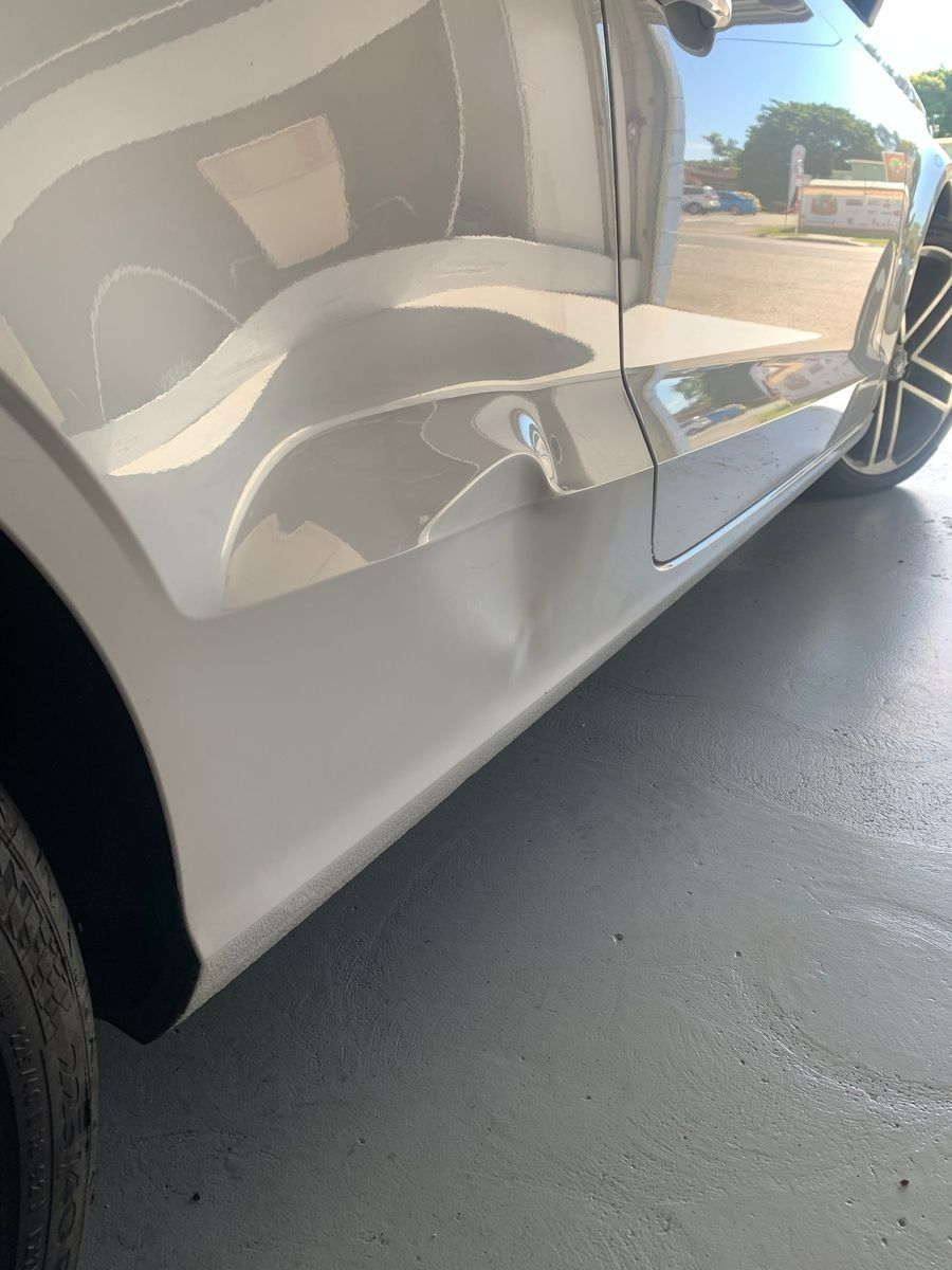 Dent in The Backend of A White Vehicle — Dent Motive in Runaway Bay, QLD