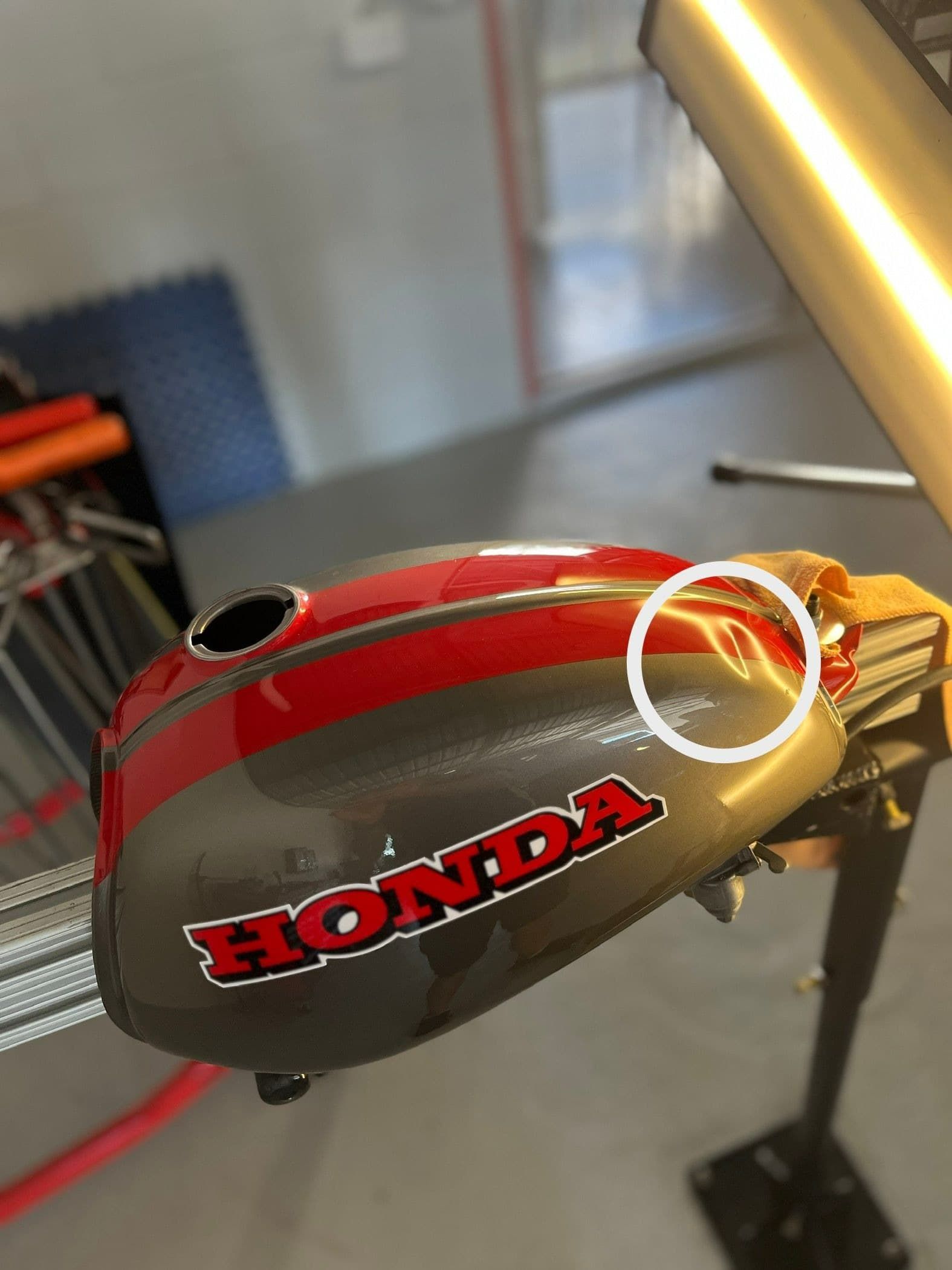 A Honda Motorcycle Is Sitting on A Table — Dent Motive in Broadbeach, QLD