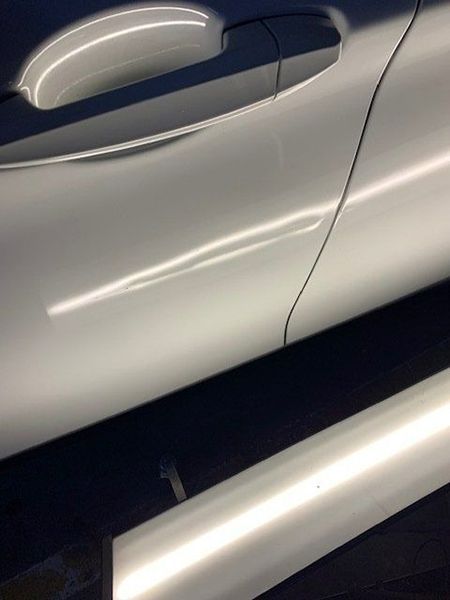 A Close-up Of the Side of A White Car — Dent Motive in Helensvale, QLD