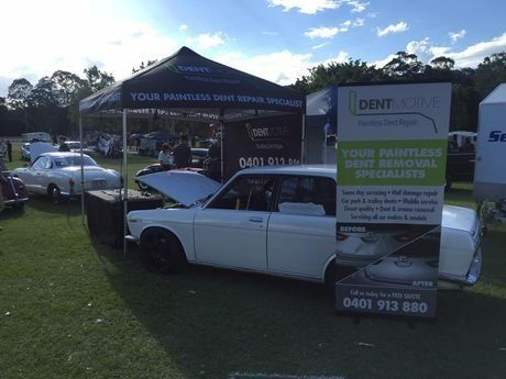 A White Car Is Parked in Front of A Tent — Dent Motive in Runaway Bay, QLD