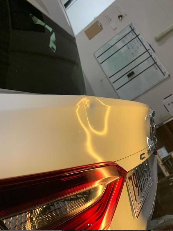 Dent in The Back of White Car — Dent Motive in Runaway Bay, QLD