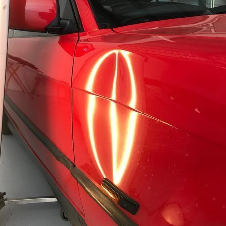 A Red Car with A Light Coming out Of It — Dent Motive in Runaway Bay, QLD