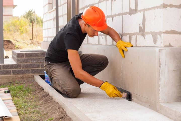Structural wall crack repair in a concrete building corner.