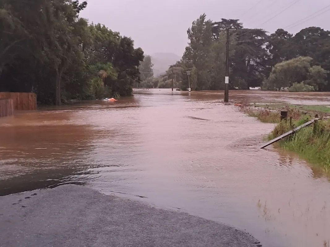 A flooded road with a lot of water on it