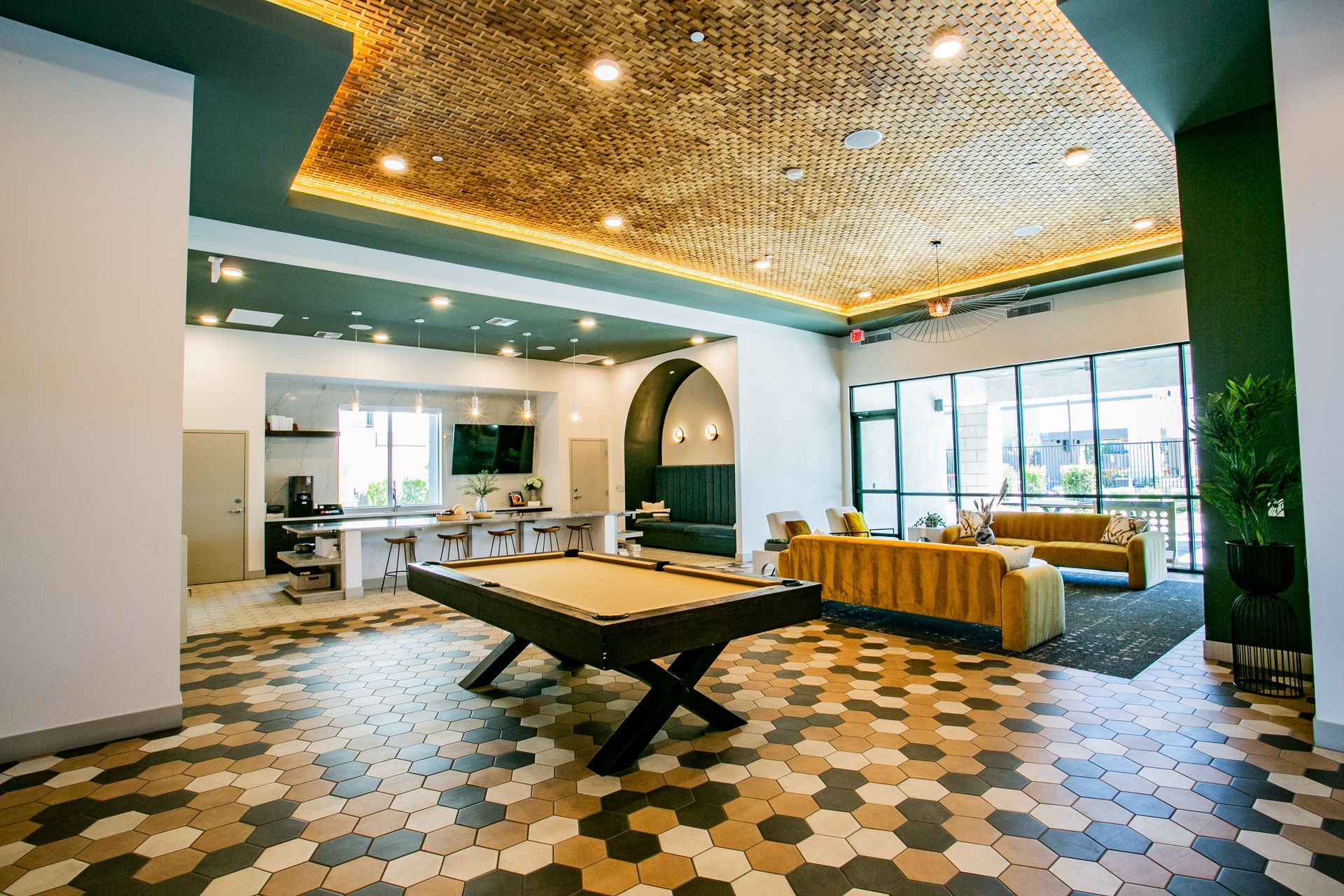 There is a pool table in the middle of the room.
