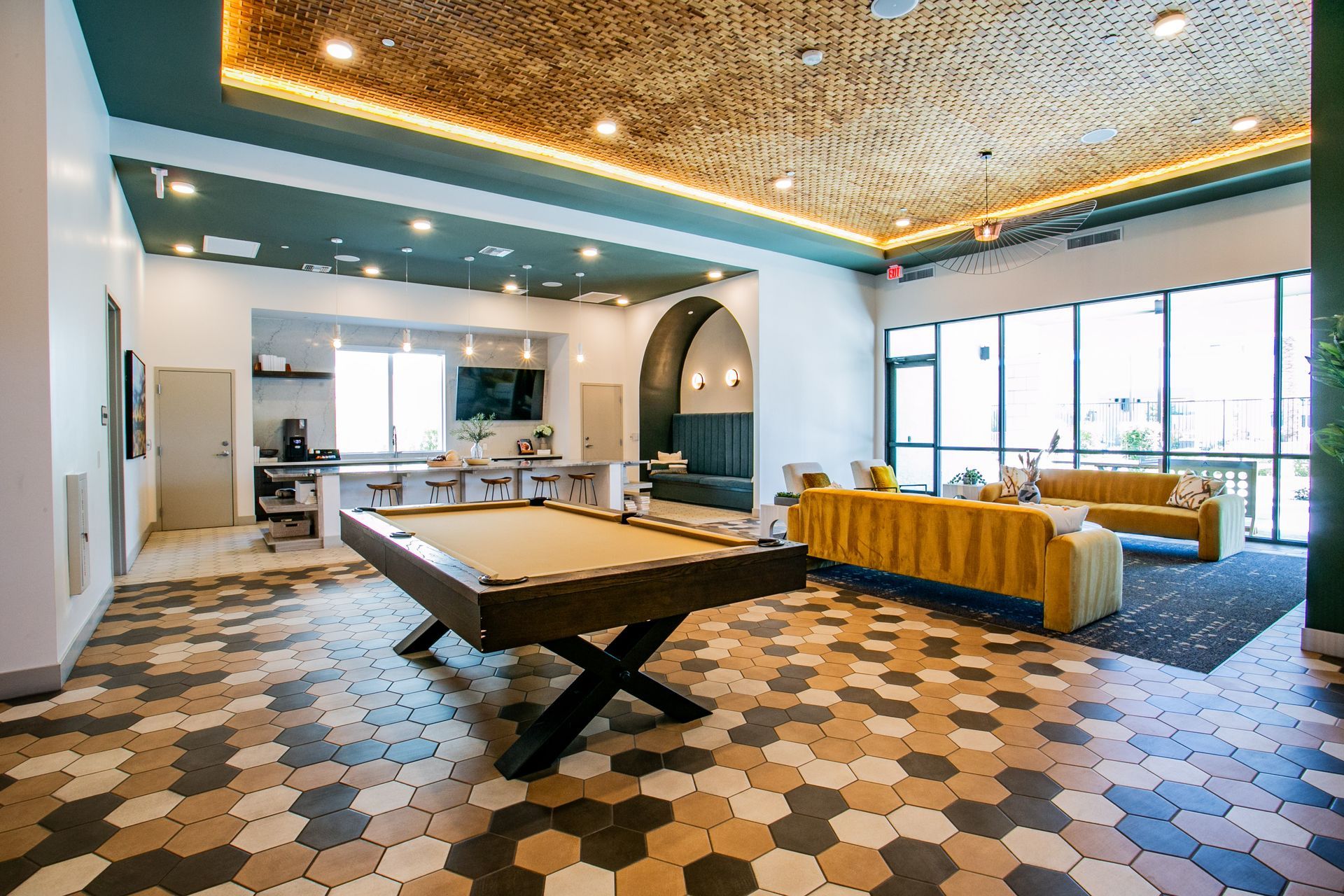 There is a pool table in the middle of the room.