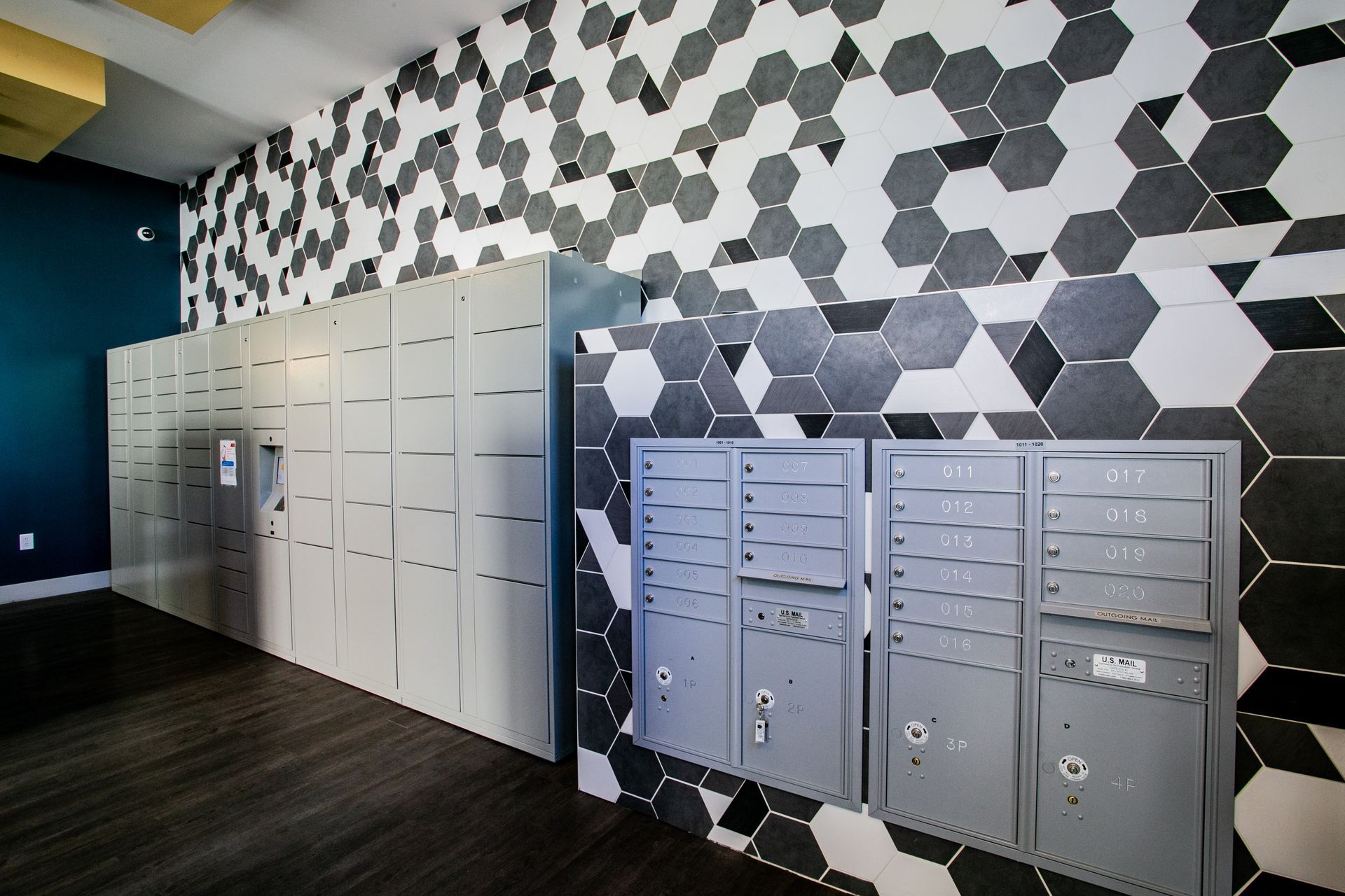 A room with a lot of mailboxes on the wall