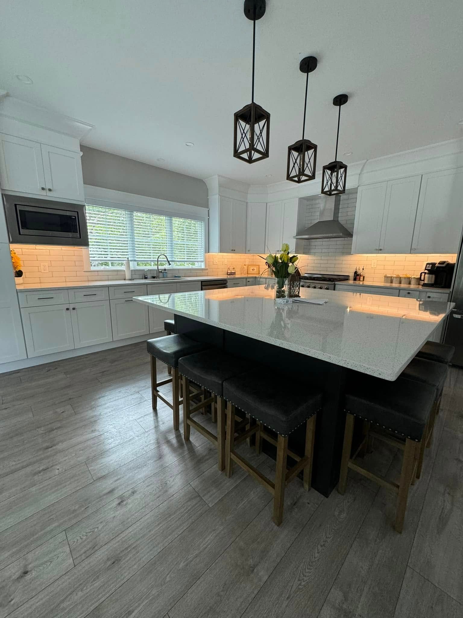 There is a large island in the middle of the kitchen.